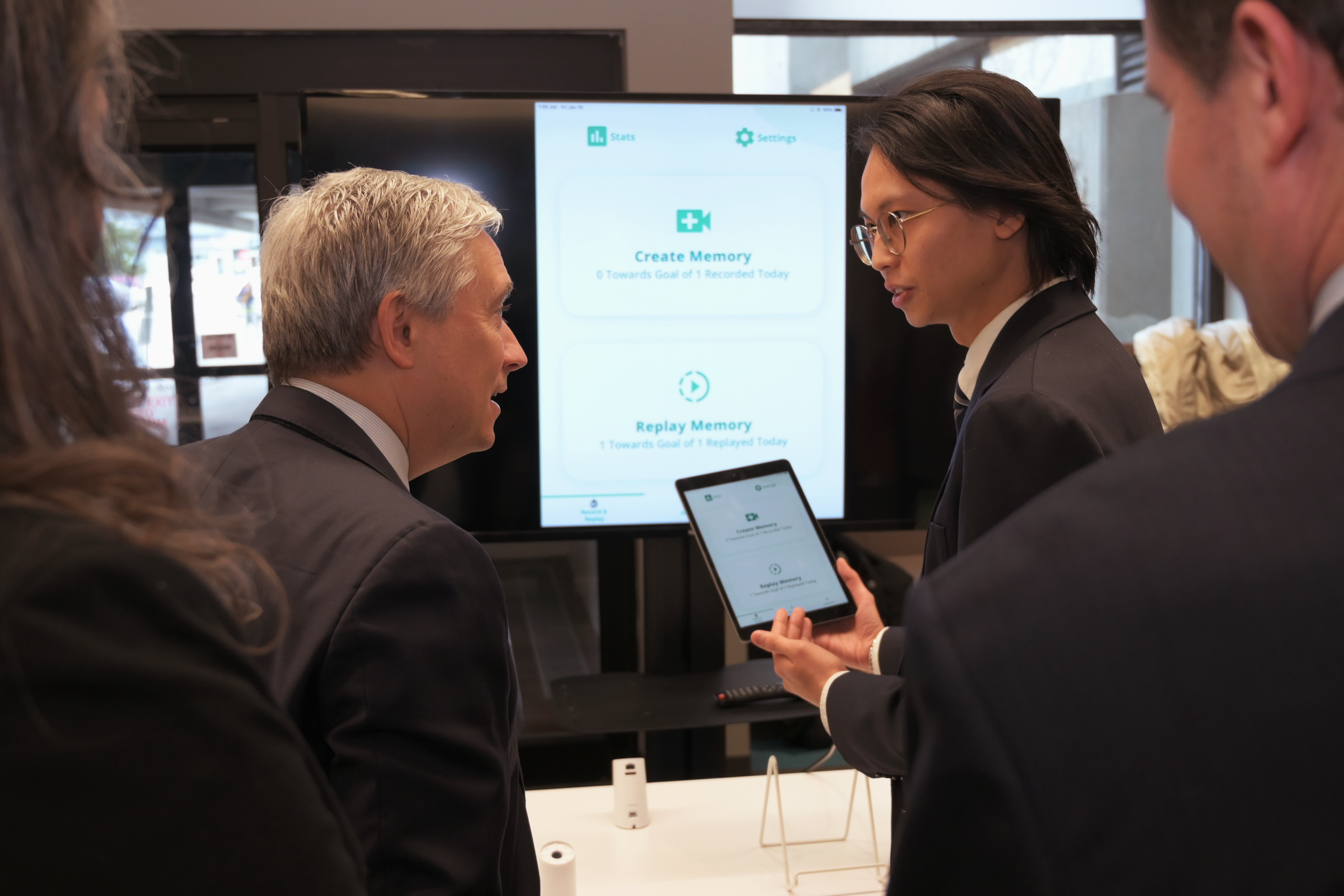 Bryan Hong sharing some of his work with HippoCamera with the Honourable François-Philippe Champagne, Minister of Innovation, Science and Industry.